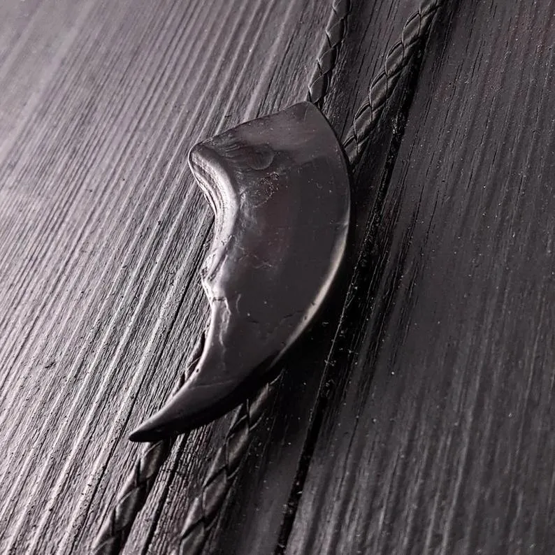 Black Bear Claw Bolo Tie Hand Cast Onyx Resin Black Braided Cord with Silver Tips